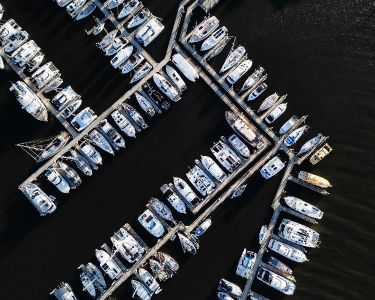 An aerial top-down view of Manly Harbour in Brisbane, Queensland at dusk