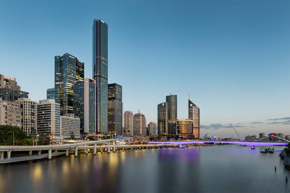 Brisbane city skyline at blue hour with illuminated skyscrapers, reflections on Brisbane River, and iconic bridges — Brisbane CBD photography print.