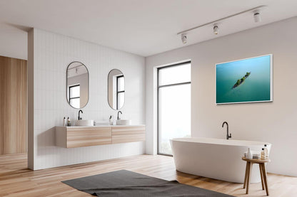 Modern bathroom with wooden vanity, freestanding bathtub, and wall-mounted TV.